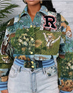 Person wearing a patchwork jacket with a 'R' logo, standing against a gray wall with greenery.
