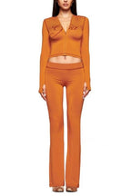 Orange outfit with 'Gia' branding on a white background