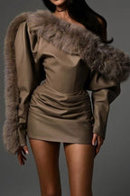 Brown dress with fur sleeves on a gray background